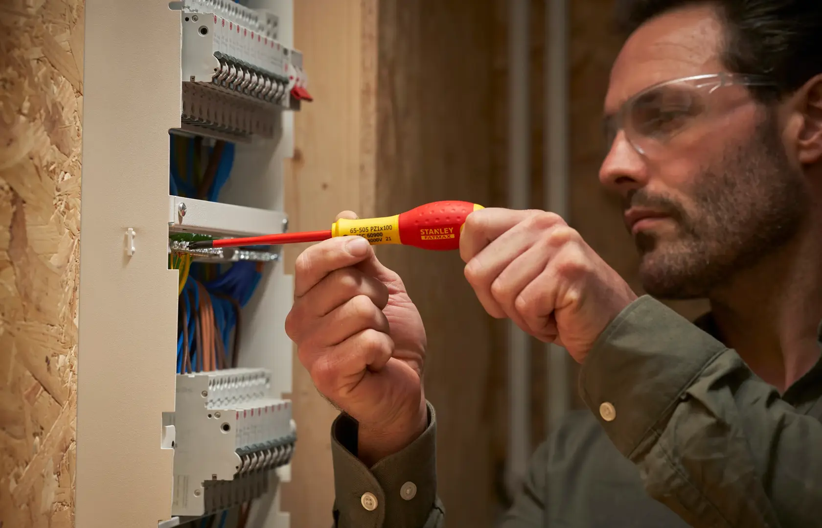 Photo of STANLEY FMHT0-62649 insulated screwdriver used on electrical panel wires.