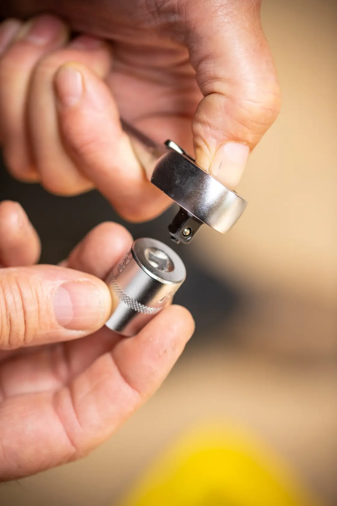 STANLEY FMMT82676-0 socket and ratchet head in hand close-up, showing connection detail.