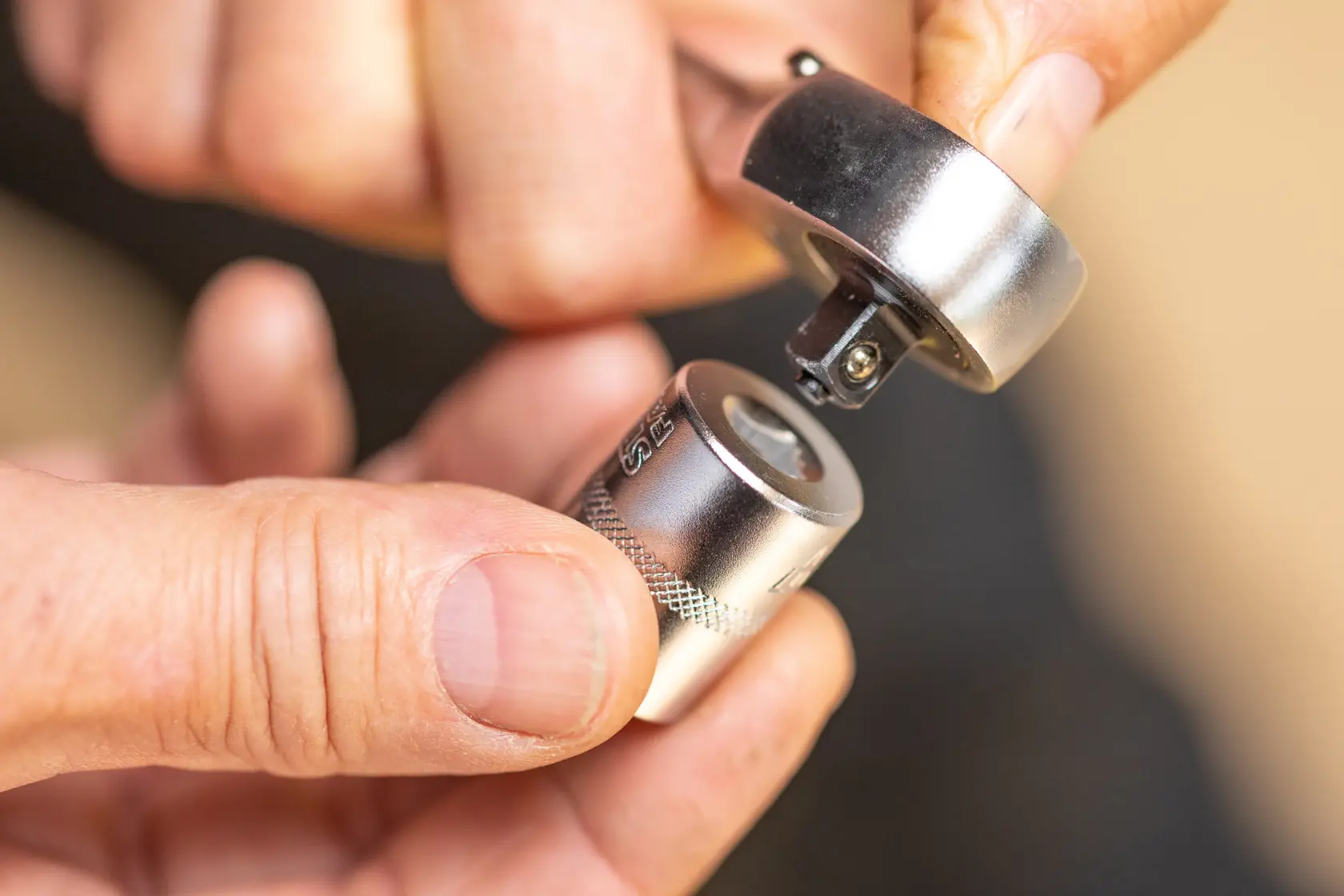 Photo of STANLEY FMMT82676-0 socket wrench head and attachment being connected close-up.