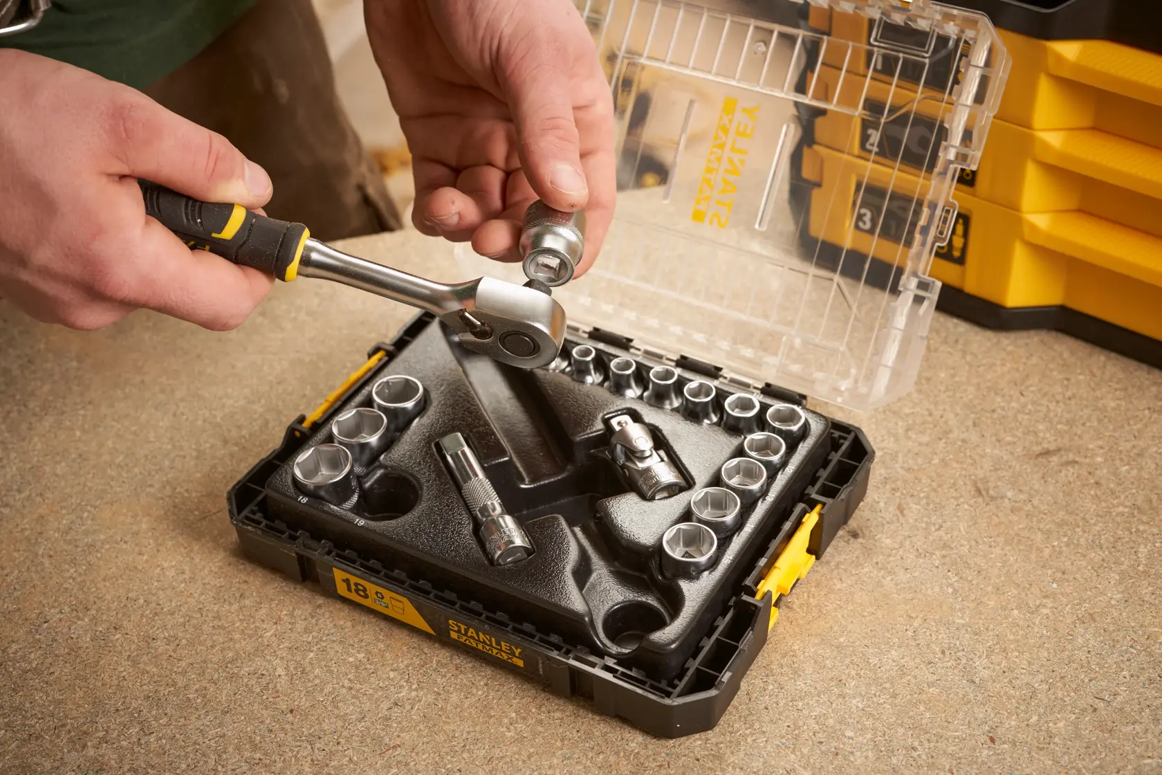 Stanley FMMT98102-0 socket set with ratchet handle, open case, photo on workbench.