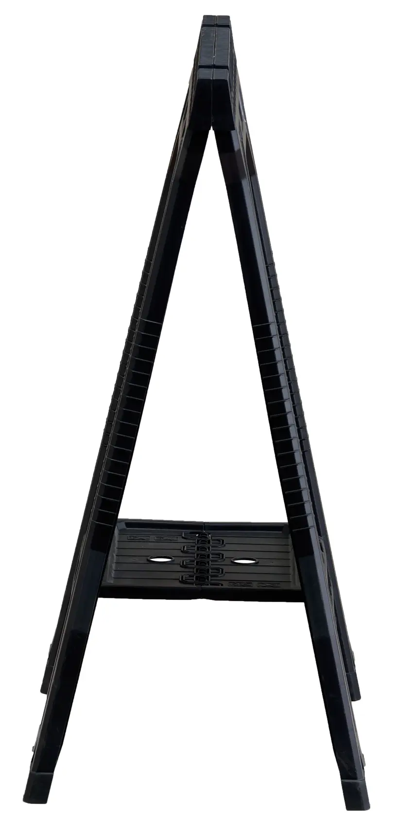 Side view of a black folding plastic sawhorse with a shelf, photographed against a white background.
